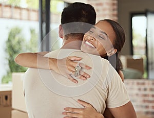 Couple, happy and hug with keys for new home, investment and family in love for growth, support and care. Mortgage, man