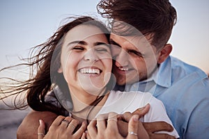 Couple, happy and sunset together for honeymoon with hands for hug at beach in zoom. Man and woman with smile on face