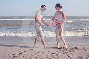 Couple have fun on the beach