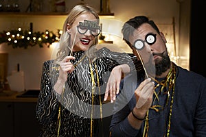 Couple have fun during making New Year`s Eve photo booths