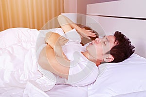 Couple have problem with man`s snoring on bed