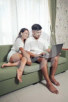 Couple have video chat with his friends or browsing social network