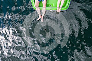 Couple haveing relaxon pedalo on clear lake