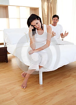 Couple having an argument in bedroom