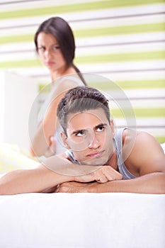 Couple having an argument in bedroom