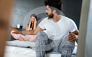 Couple having arguments and sexual problems in bed