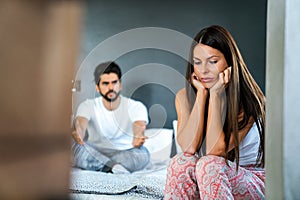 Couple having arguments and sexual problems in bed