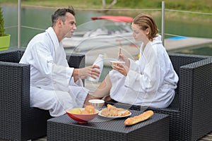 couple having breakfast on hotel terrace