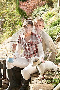 Couple Having Coffee Break Outdoors In G