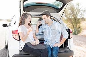 Couple having a coffee break while traveling