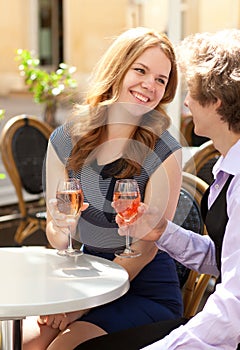 Couple having a date and drinking rose wine