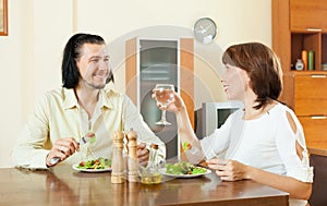 Couple having dinner with vegetables in sweet home