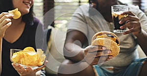 Couple having fast food on the couch