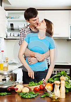 Couple having flirt at kitchen