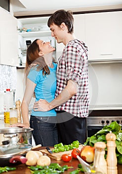 Couple having flirt at kitchen