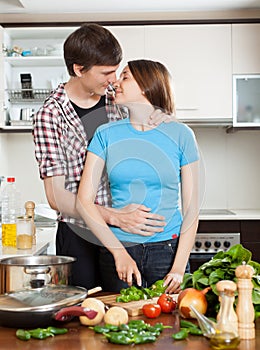 Couple having flirt at kitchen