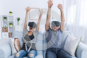 Couple having fun with 3D roller coaster