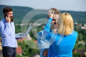 Couple having fun while busy businessman speak on phone. Face to face conversation advantages concept. Couple happy