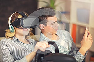 Couple having fun enjoying VR glasses