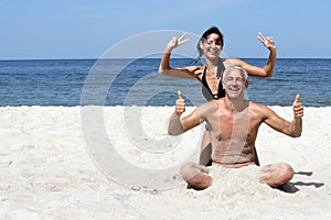 Couple having fun indicating OK signs