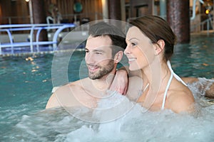 Couple having fun in jacuzzi