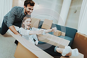 Couple Having Fun During Moving In New Apartment.