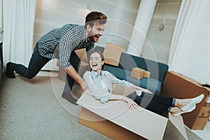 Couple Having Fun During Moving In New Apartment.