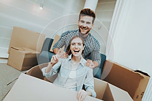 Couple Having Fun During Moving In New Apartment.