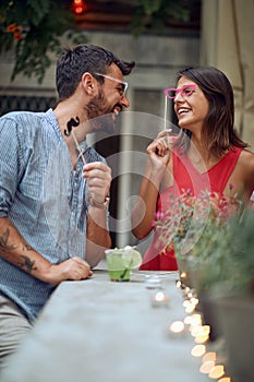 A couple having fun at the open air birthday party. Quality friendship time together