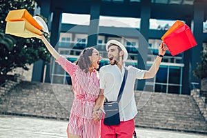 Couple having fun outdoor while doing shopping