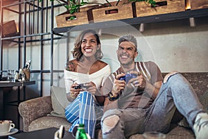 Couple having fun while playing video games.