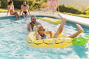 Couple having fun at a poolside party