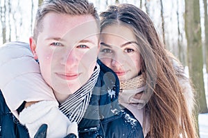 Couple having fun in snowy park