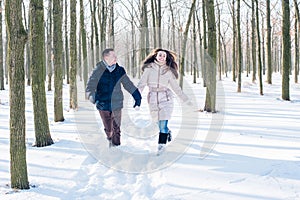 Couple having fun in snowy park