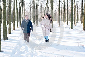 Couple having fun in snowy park