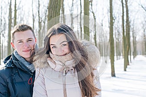 Couple having fun in snowy park