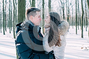 Couple having fun in snowy park