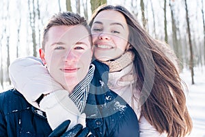 Couple having fun in snowy park