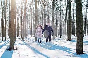 Couple having fun in snowy park