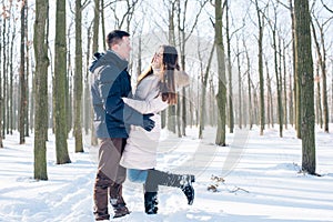 Couple having fun in snowy park