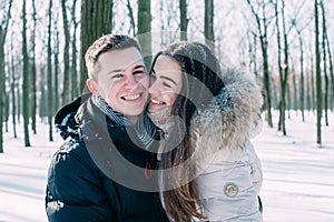 Couple having fun in snowy park