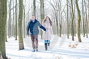 Couple having fun in snowy park