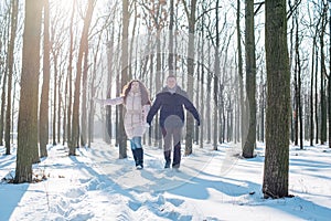 Couple having fun in snowy park