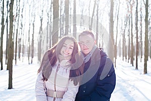 Couple having fun in snowy park