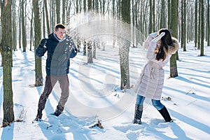 Couple having fun in snowy park