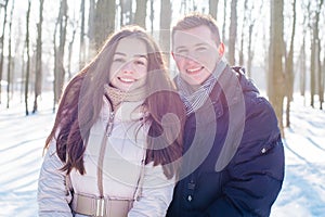 Couple having fun in snowy park