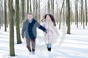 Couple having fun in snowy park