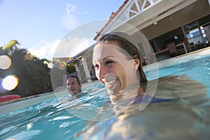 Couple having fun in the swimming pool