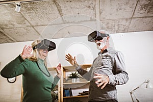 Couple having fun with virtual reality glasses