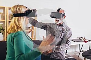 Couple having fun with virtual reality glasses.Quarantine